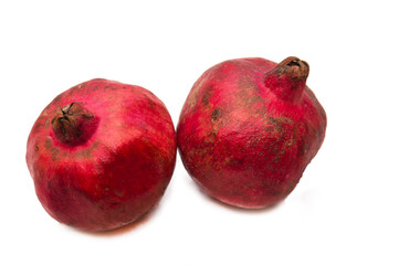 winter fruit, red pomegranate isolated on white