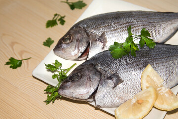fresh fish with lemon and parsley