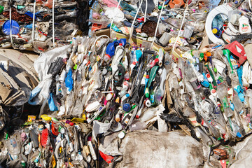 01.11.2019 Vinnitsa, Ukraine: recyclable waste at a recycling plant, close up plastic bottles and cellophane bags in front of recycle factory centre