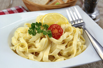 fresh tagliatelle butter on a plate