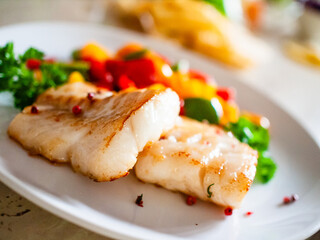 Fish dish - fried fish fillet and vegetables - obrazy, fototapety, plakaty