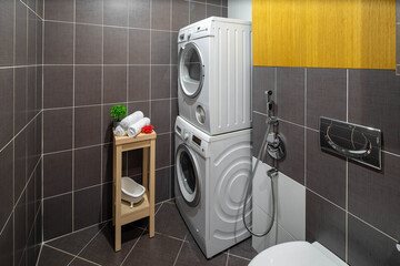 Sink, toilet, washing machine. Modern interior of bathroom.