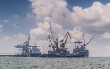 Fototapeta premium Logistics and transportation of International Container Cargo ship in the ocean at Sunshine sky, Freight Transportation, Shipping