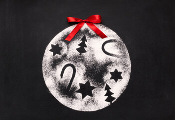 Decoration ball with pictures of sugar on chalkboard © Prostock-studio