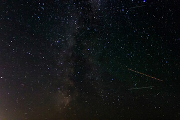 Obraz na płótnie Canvas Beautiful Background of Milky Way galaxy night sky stars shooting star, meteorite and comet
