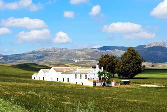 Spanish farmhouse with mountains to the rear near Ronda, Spain.