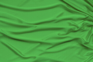beautiful satin draped with soft folds fabric, silk cloth background, close-up, copy space