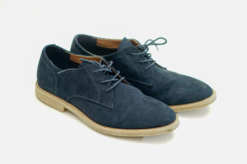 Simple fashion velvet navy blue shoes on white background