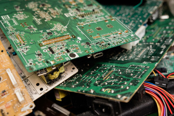 Group of parts of demounted gadgets with cords ready to be examined and repaired