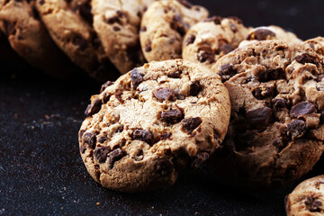 Chocolate cookies on wooden table. Chocolate chip cookies shot on table
