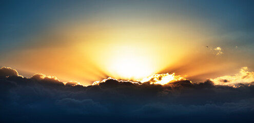 Blue sky with clouds and sunrise.