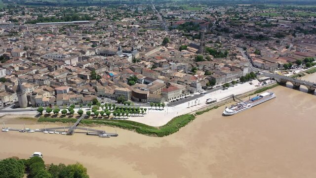 Panoramic aerial view of Libourne city on Dordogne river on sunny summer day, Gironde, France
