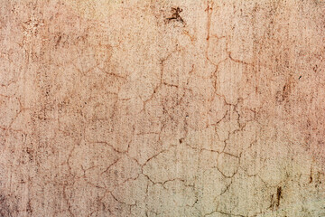 Texture of a concrete wall with cracks and scratches which can be used as a background