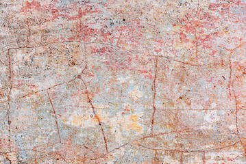 Texture of a concrete wall with cracks and scratches which can be used as a background