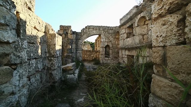 Moving camera among old Roman ruins at Tyre, Lebanon