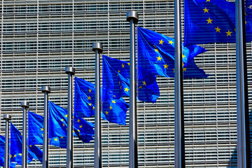 EU Flags in front of the European Union Commission building in Brussels, Belgium