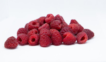 raspberries on a white background