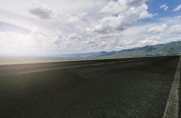 empty highway with blue sky and beautiful mountain.