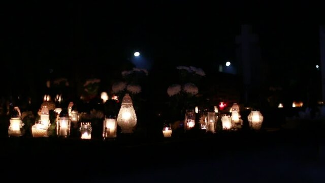 Close-Up Of Candles Burning At A Cemetery During All Saints Day.