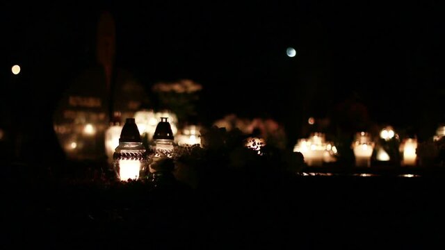 Close-Up Of Candles Burning At A Cemetery During All Saints Day.