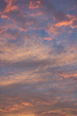 Fototapeta premium Beautiful and romantic clouds of warm colors during sunset. Sunset as background. Resource for designers.