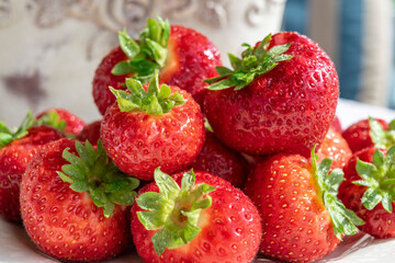 Red ripe strawberries close up. Healthy sweet fruit dessert. Red fruits and berries rich in vitamins and minerals.