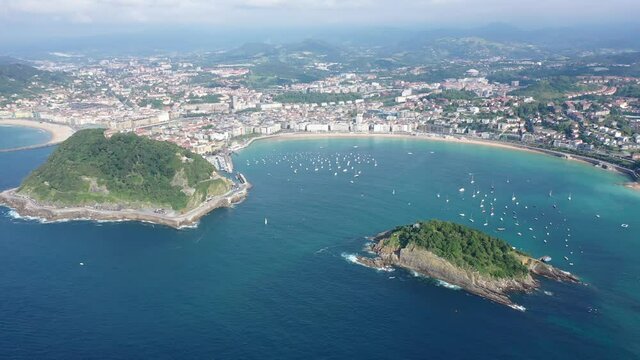 Aerial panoramic view of summer seascape with La Concha Bay and coastal city of San Sebastian, Basque Country, Spain