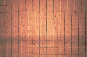 Wall tiles illuminated by sunshine background