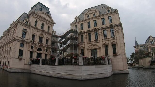 Old historical buildings with staircase in imitation Venice. Dalian, China. static, Fish eye