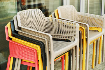 Many plastic multi-colored chairs