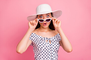 Photo of feared worried cute girl seeing airplane wing falling off while isolated with pink background