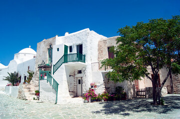 The historic old town of the Greek island of Folegandros. Traditional houses in the fortified part of the settlement, the Kastro.  Whitewashed buildings with external staircases.