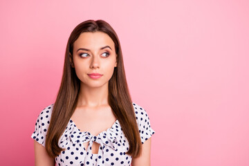 Photo of cute charming lovely girl thinking on something cunning while isolated with pink background