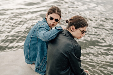 Two Stylish Twins Brothers Posing on the Pier Near the River