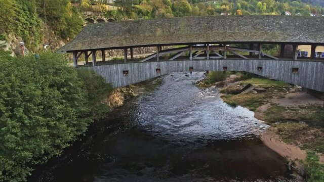 4k Aerial view of wood bridge over Murg river, Forbach, Germany