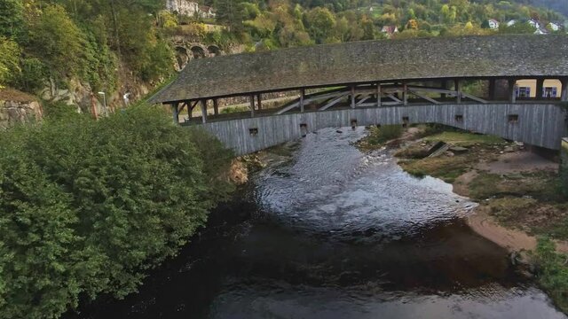 4k Aerial view of wood bridge over Murg river, Forbach, Germany