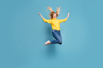 Full body photo of crazy lady jumping high enjoy warm autumn breeze hairdo flying cheerful person...