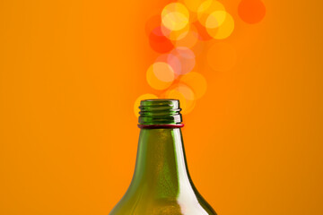 Beautiful bokeh spilling out of a glass bottleneck