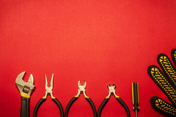 Tools for master builder and accessories on red background
