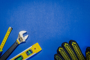 Tools for master builder and accessories on blue background