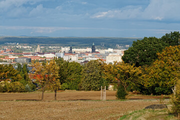 View over the city of Dresden from southwest direction with Frauenkirche, Rathausurm, Waldschlösschenbrücke and other sights, autumn atmosphere, coloured trees in the foreground, contrasting sky