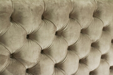 Luxury velour quilted sofa upholstery with buttons, elegant home decor texture and background