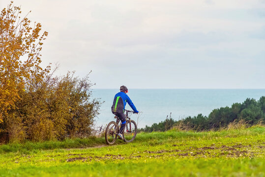 seniors doing mountain bike in a beautiful landscape of the coast in the north of France