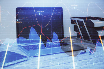 Stock market chart and desktop office computer background. Multi exposure. Concept of financial...