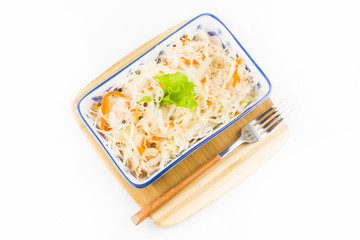 fermented sauerkraut with carrots cooked at home in a plate on the table. home winter harvesting vegetables. healthy delicious vegetarian food