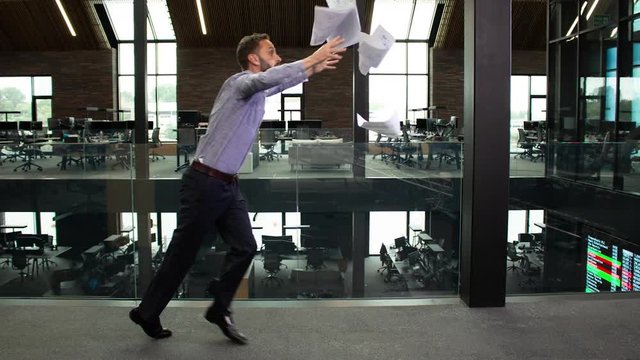 Bullet time shot of clumsy businessman tripping in the office