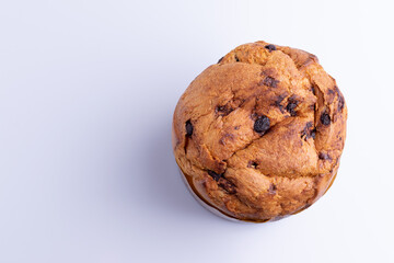 Christmas chocolate cake panettone on white background, soft light, top view, also know as chocotone panetone
