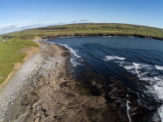 Aerial view of beach with farms and Cliffs of Moher
