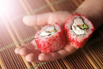 Japanese rolls in children's hand so close