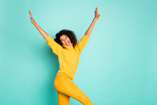 Profile Photo Of Cool Dark Skin Lady Holding Hands Raised Walking Down Street Childish Mood Wear Yellow Knitted Pullover Stylish Pants Isolated Blue Teal Color Background